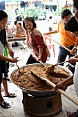 The traditional way of making Thai sweet rice
