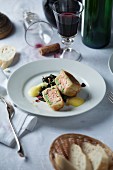 Salmon fillet in strudel pastry with red wine spinach