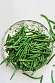 A plate of frozen green beans (seen from above)