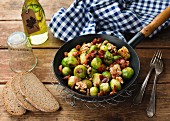 Fried Brussels sprouts with bacon and walnuts