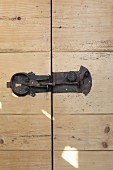 Wrought iron lock on wooden door