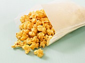 Caramel popcorn in a paper bag