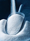 Sugar being poured into a scoop