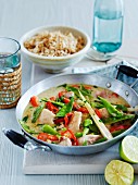 Thai curry with chicken, mange tout and chillis