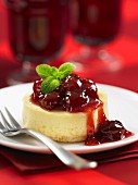 A mini cheesecake with sour cherry jam