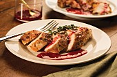 Chicken breast fillets with a balsamic vinegar glaze and raspberry sauce