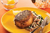 Roasted pork medallion with tomato and spinach rice