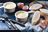 Baked eggs with bread and vintage cutlery