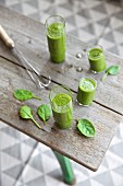 A green spinach and apple smoothie with celery