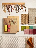 Interior design samples of various fabrics, sisal and wood