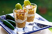 Esquites (Mexican corn salad with epazote, savory, chilli peppers, mayonnaise and chilli powder)