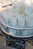 Ricotta on a stand in a cheese shop