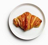 A croissant on a plate