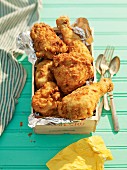 Buttermilk fried chicken in a wooden crate for a picnic