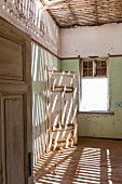 An abandoned house in Kolmannskuppe, Namibia, Africa – years ago the place was overrun by diamond prospectors, today it is a ghost town open to tourists