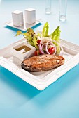Grilled salmon chop with Caesar salad