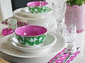 White place setting with colourful bowl and romantic pattern