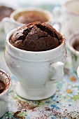 A chocolate pot with cocoa powder