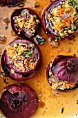 Red onions filled with couscous, dried apricots and herbs