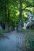 An entrance to the village church with its historical graveyard, Mellenthin on the island of Usedom, Mecklenburg-Vorpommern