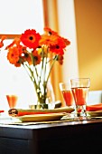 A summery laid table with gerberas and Californian wine