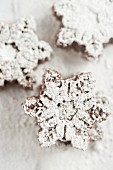 Mini snowflake-shaped chocolate cakes dusted with icing sugar