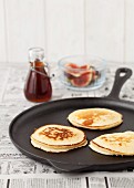 Three American pancakes in a pan ready to be served