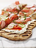 Grilled unleavened bread with cream cheese and salmon