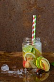Homemade lemonade in a screw-top jar with straws