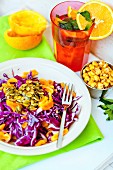 Red cabbage salad with oranges and pumpkin seeds