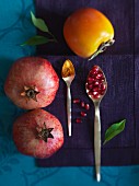 Pomegranates, a persimmon and turmeric