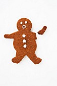A shocked looking gingerbread man with a broken arm