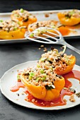 Peppers filled with couscous, spring onions and dried tomatoes