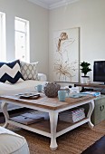 Vintage, country-house-style coffee table, sofa and drawing of girl in wearing tutu