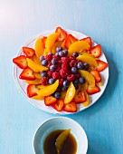 Orange and berry salad with a dressing made from maple syrup, rice vinegar and tamari