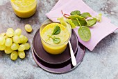 A mango smoothie made with grapes, chard and spinach