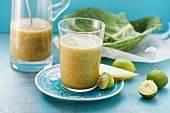 A savoy cabbage smoothie made with papaya, figs, honeydew melon and limes