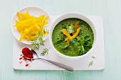 A green smoothie made from figs, yellow peppers, courgettes and lambs lettuce served as a soup