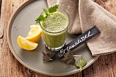 Stinging nettle and yarrow smoothie made with apples, dates and lemon juice