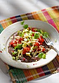 Tex-Mex waffles made from black beans and potatoes with vegetables and grated cheese
