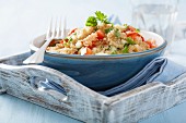 Quinoa salad with tomatoes, cucumber and parsley