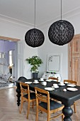 Eclectic, elegant dining room in black and white colour scheme with period ambiance