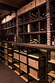 Wood and stone shelving in rustic wine cellar