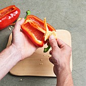 Stem being removed from a pepper