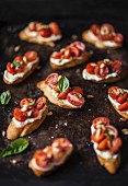 Bruschetta with tomatoes, whipped goat cheese and pine nuts