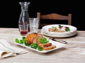 Stuffed duck breast with pea shoots