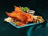 Peking duck with pancakes, cucumber and spring rolls (China)