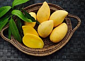 Yellow mangos in a basket