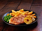 Ham steak with pineapple and chips