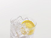 Lemonade in a glass with fresh lemon